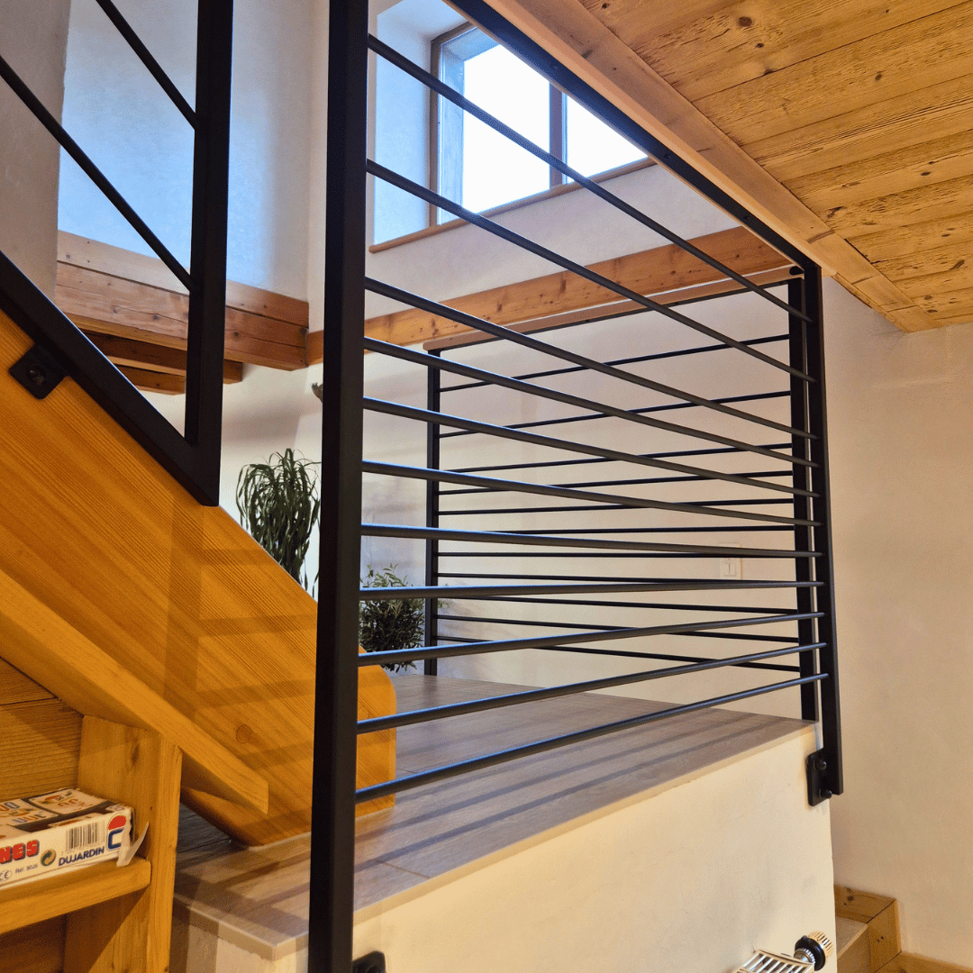 Barrière d'escalier fabriquée par Nuguet Mobilier Concept dans le Doubs.